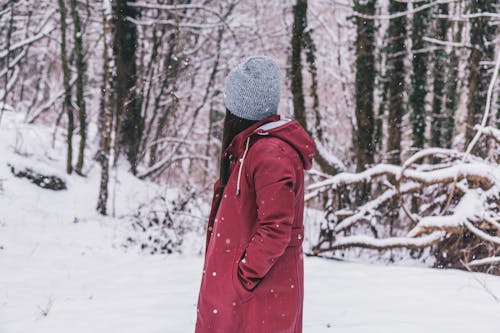 Woman Wearing Red Jacket and Gray Cap