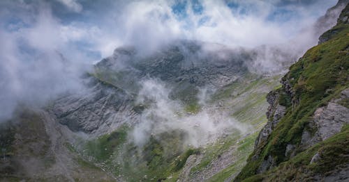 Green and Gray Mountain Under White Clouds and Blue Sky