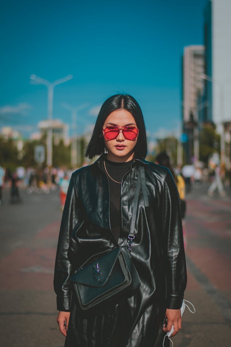 Woman In Black Leather Jacket Wearing Pink Sunglasses