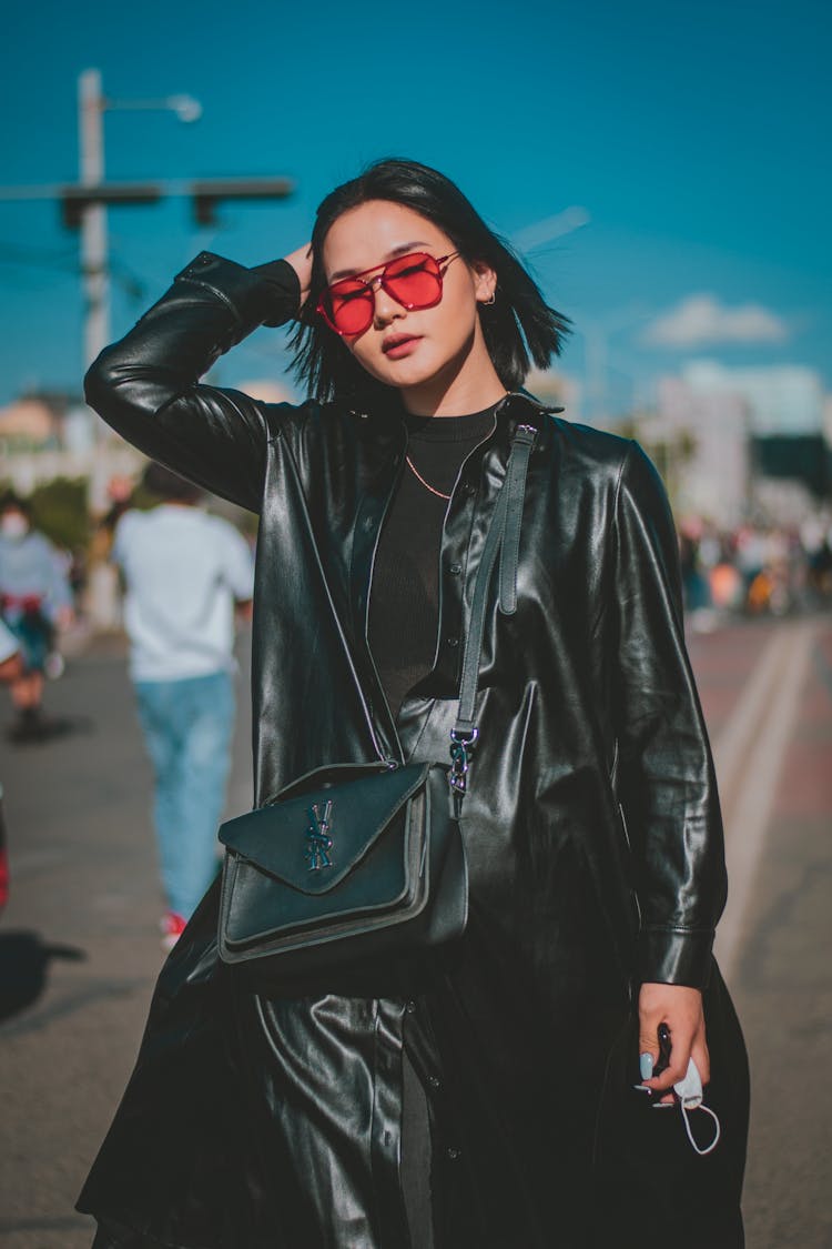 Woman In Black Leather Coat Wearing Pink Sunglasses