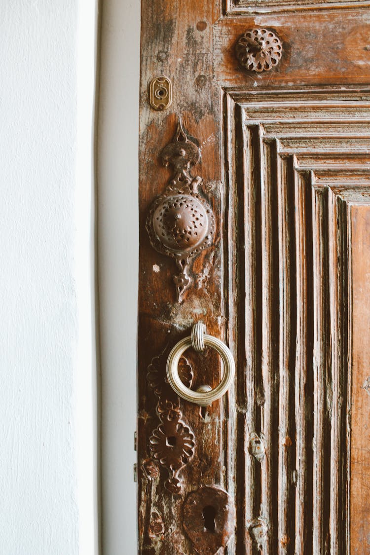 Ring Door Knocker On Brown Wood