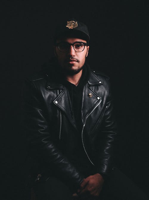 Man in Black Leather Jacket with Half Face Dark Half Face Visible