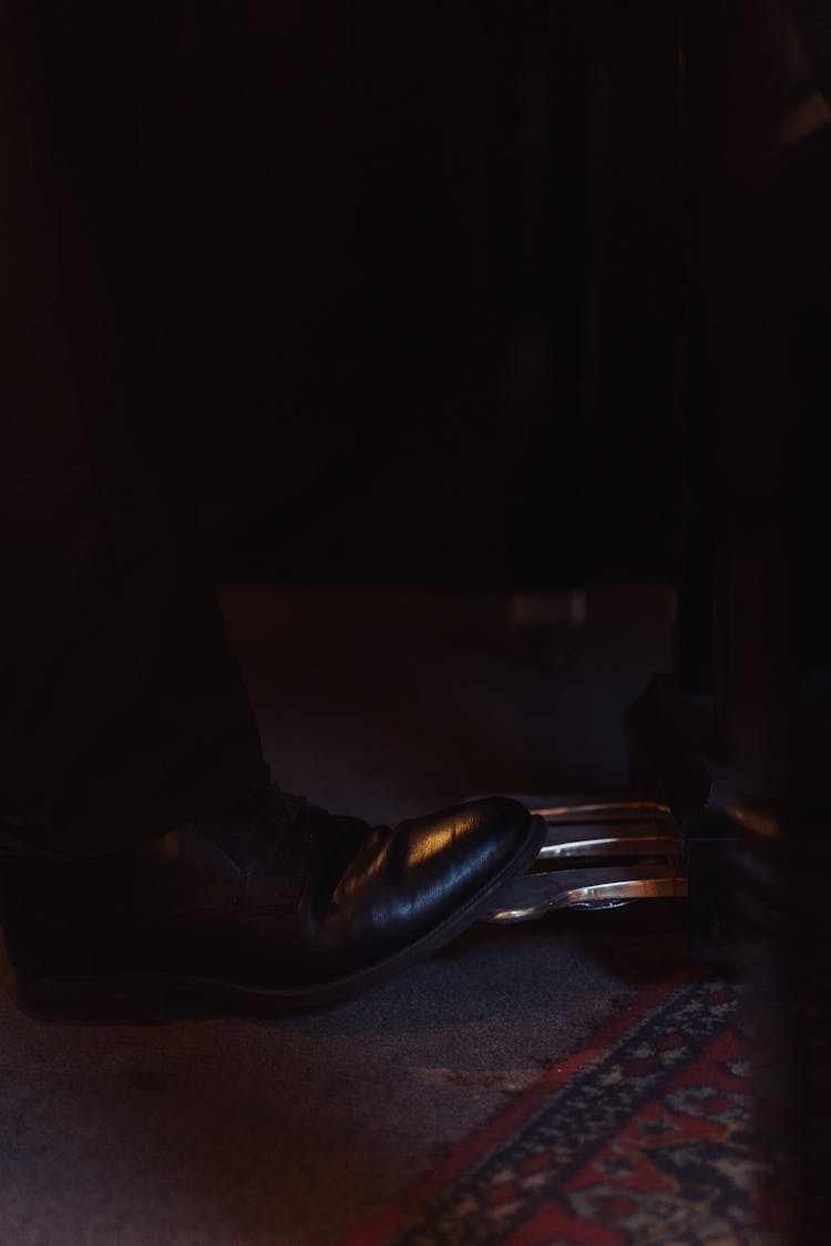 A Person Foot On A Piano Pedal