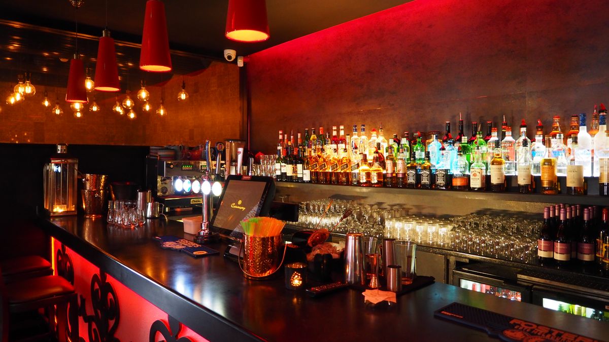 Warm pendant lighting over tables