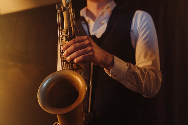 A Person Playing A Saxophone