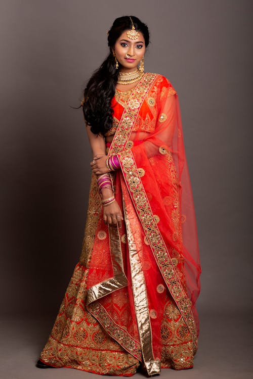 Free Woman in Red and Gold Sari Dress Stock Photo