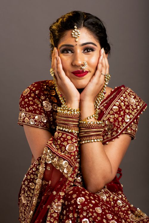 An Elegant Woman in a Red Saree Posing · Free Stock Photo