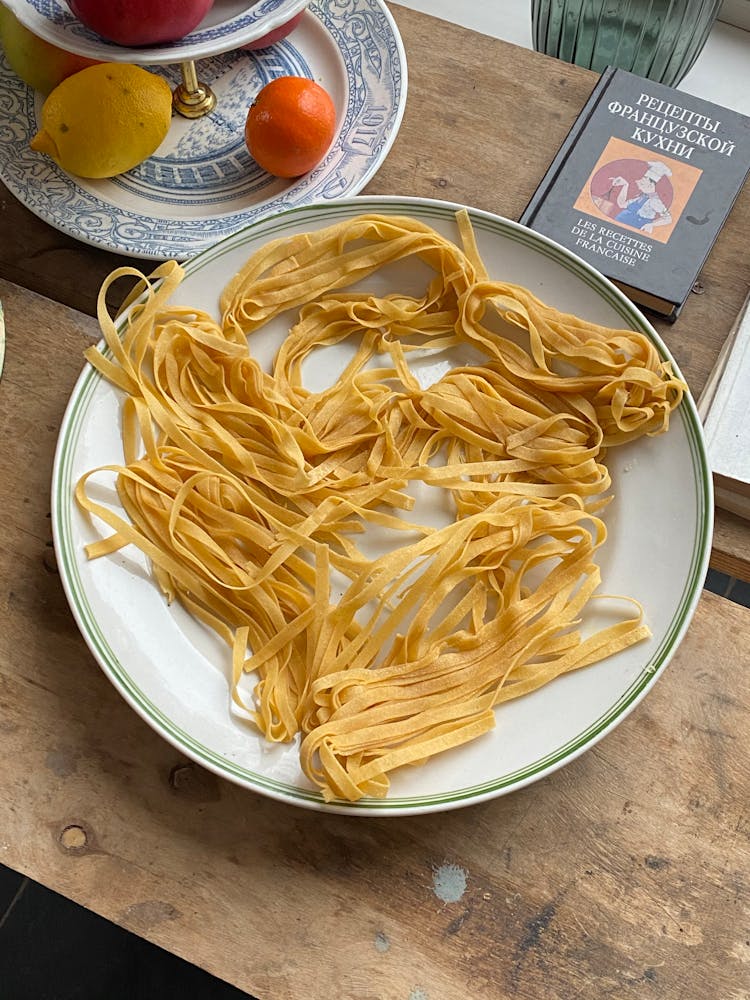 Uncooked Pasta On White Ceramic Plate