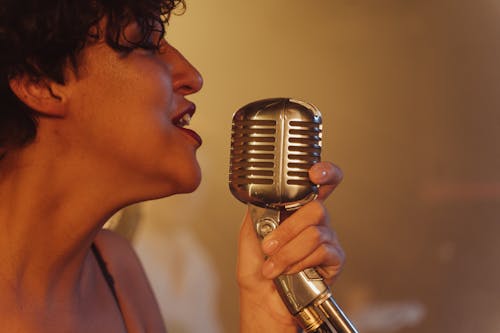 Close-Up Shot of a Woman Singing