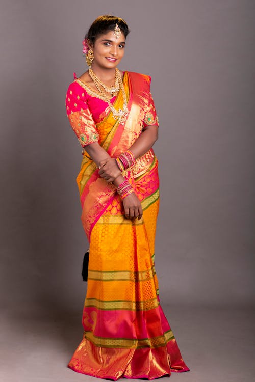 Free Woman in Red Yellow and Orange Sari Stock Photo