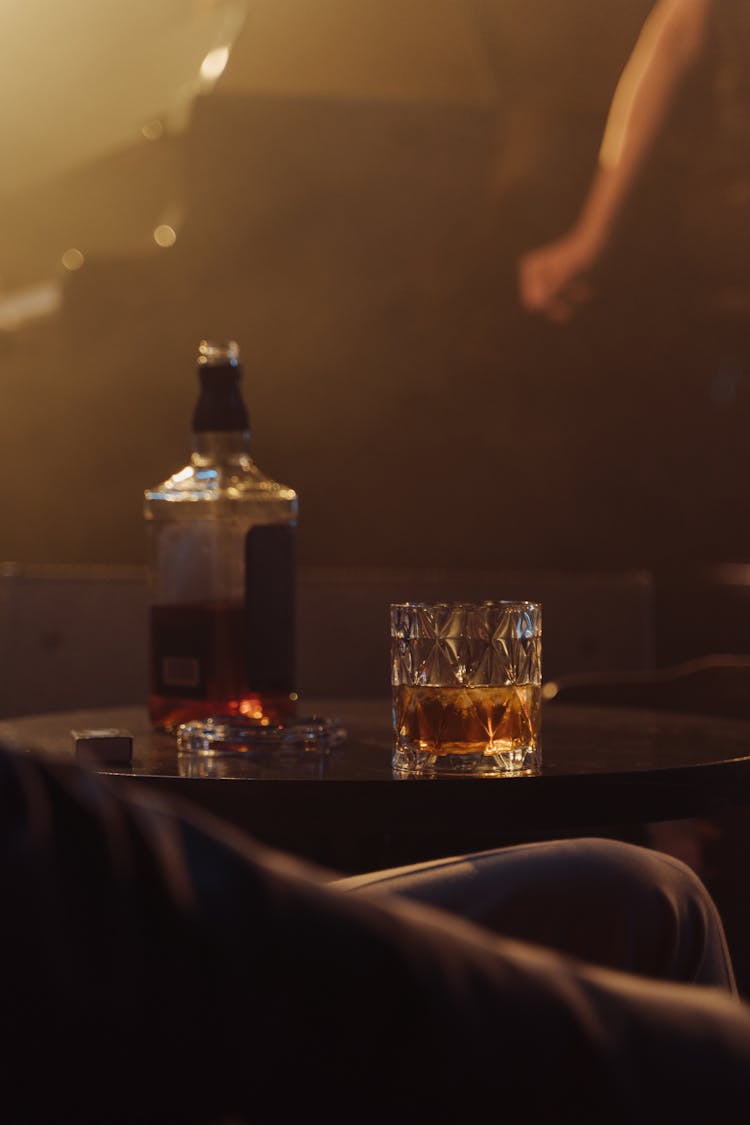 Whiskey Bottle Beside The Drinking Glass