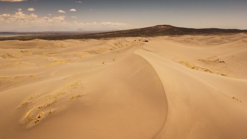 Free A breathtaking view of the arid sand dunes in Mendoza, Argentina, showcasing nature's raw beauty. Stock Photo