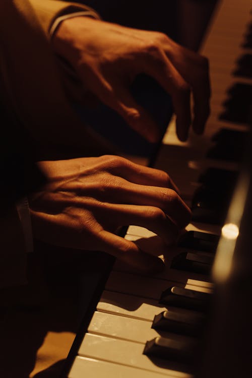 Free Close-Up Shot of a Person Playing Piano Stock Photo