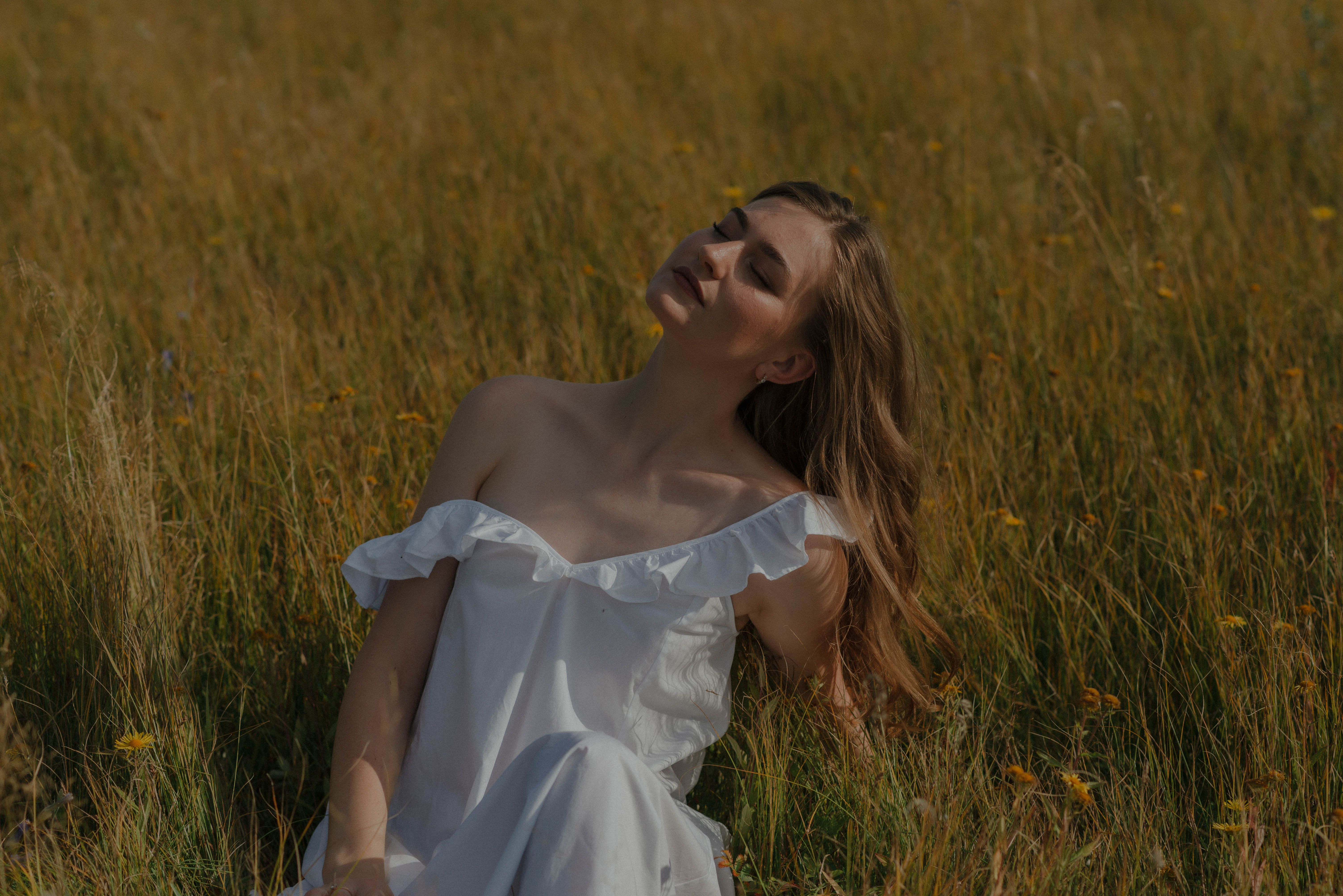 Woman in White Dress Sitting on Grass · Free Stock Photo
