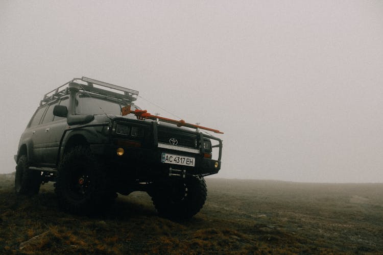 A 4x4 Sports Utility Vehicle In The Grass