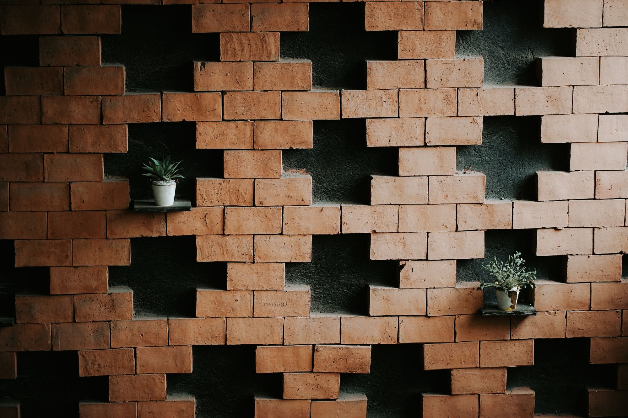 A terracotta brick lattice wall