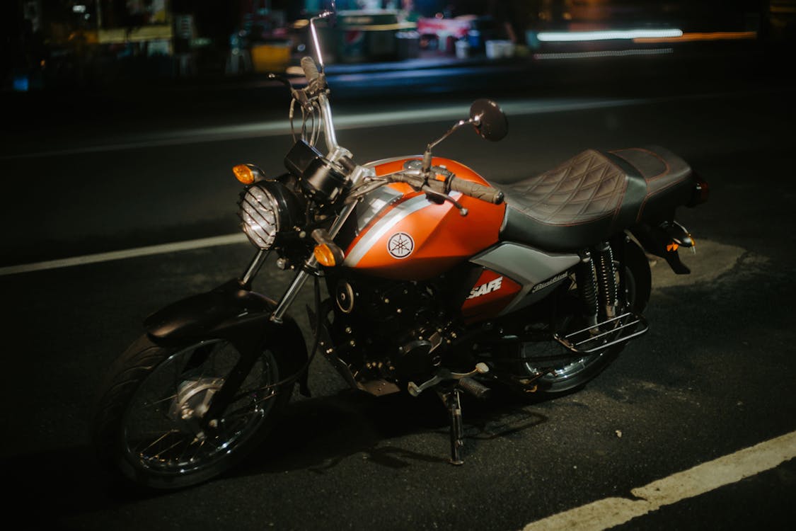 Free Orange and Black Motorcycle on Road at Night Stock Photo