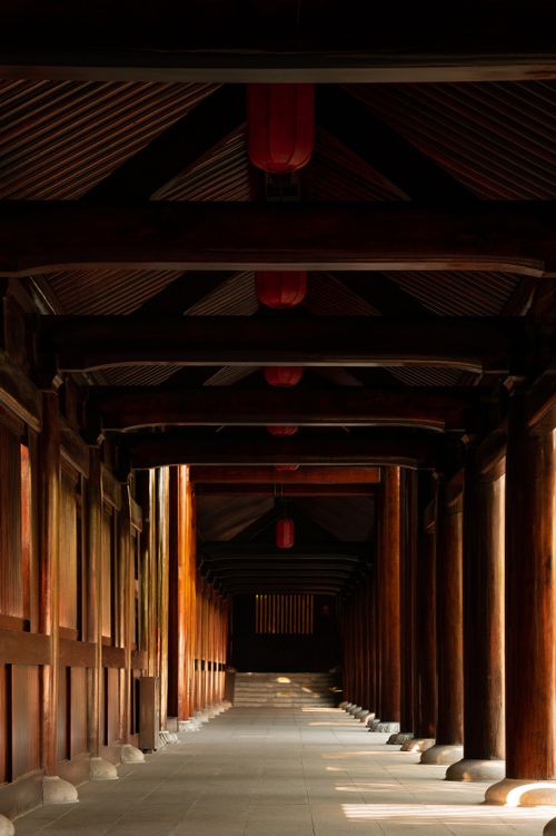 Free Serene wooden corridor with pillars, featuring traditional architecture in Shanghai, China. Stock Photo
