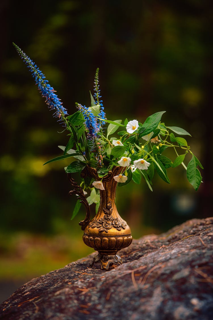Blue And White Flowers In Brown Vase