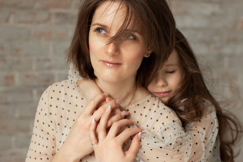 Daughter Hugging Her Mother