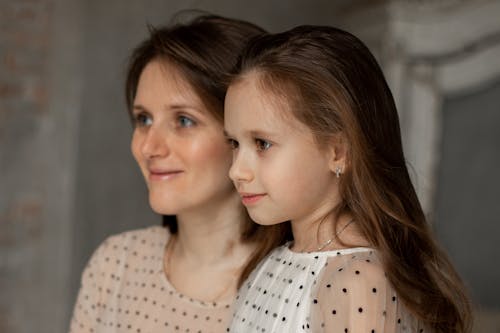 Headshot of Mother and Daughter Wearing Polka Dots Shirt