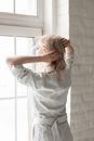 A Woman Looking Out the Window