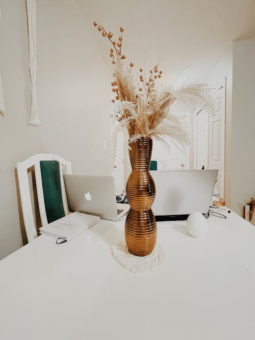 Free A Figurative Flower Vase on White Table Stock Photo