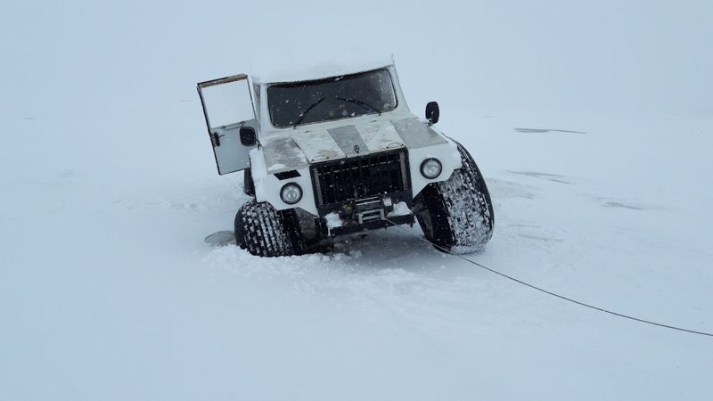 Off-road recovery truck working in snowy central New York conditions