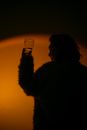 Person Raising a Drinking Glass
