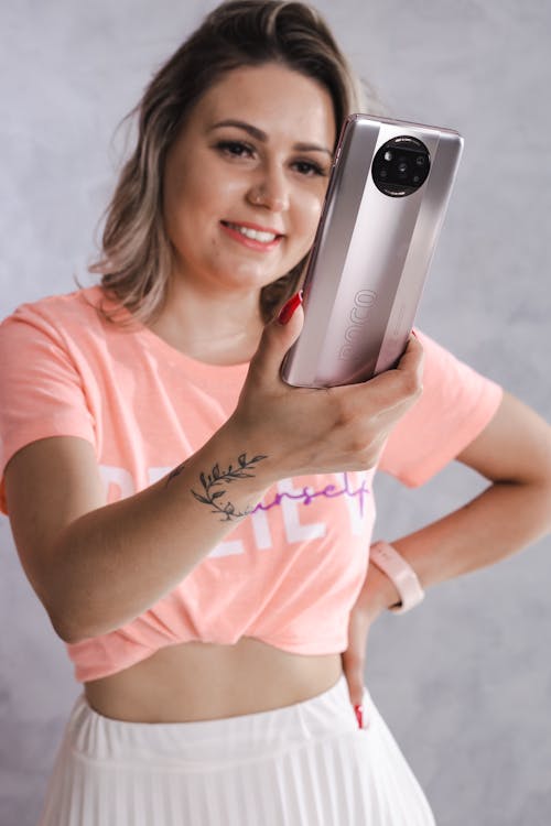 Free Woman in Crop Top Taking a Selfie Stock Photo