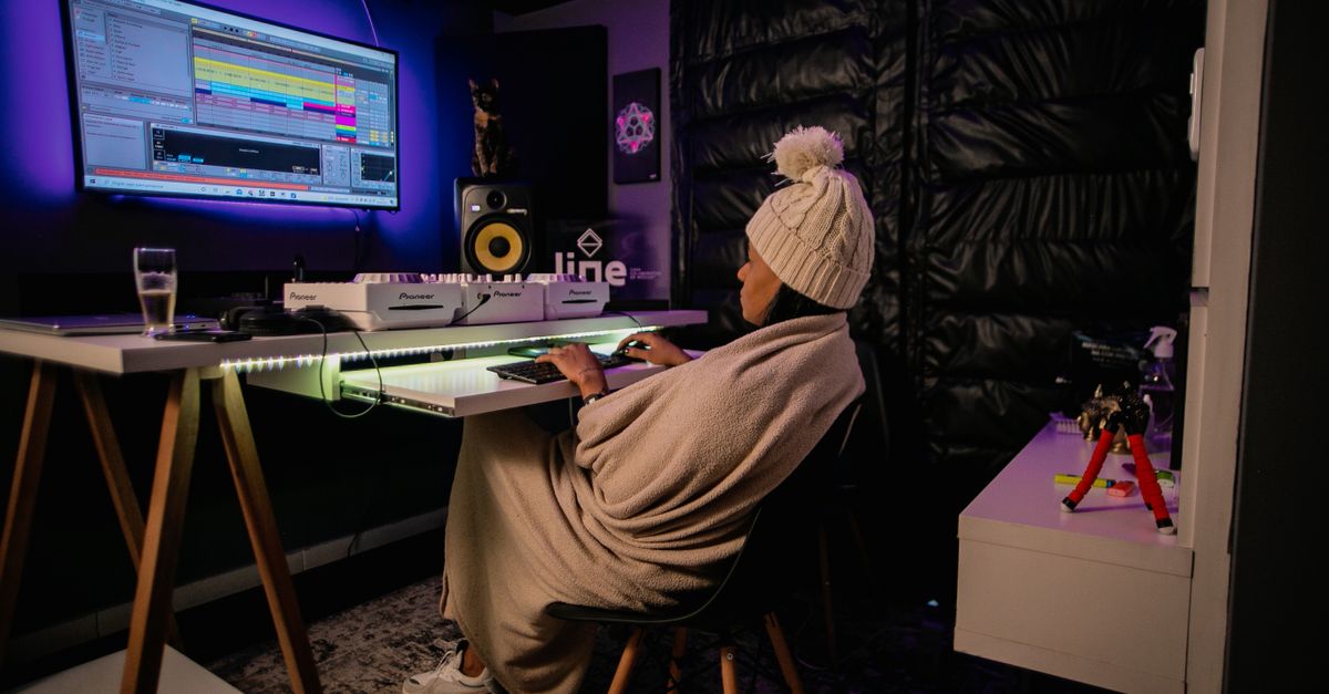 African music producer using local music software in a home studio
