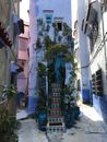 Narrow Alley between Old House Buildings
