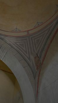 Intricate fresco on arched ceiling of a historic building interior, showcasing classical architecture.