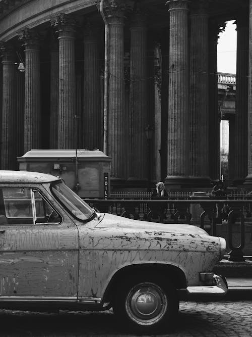 Free Grayscale Photo of an Old Car on Road Stock Photo