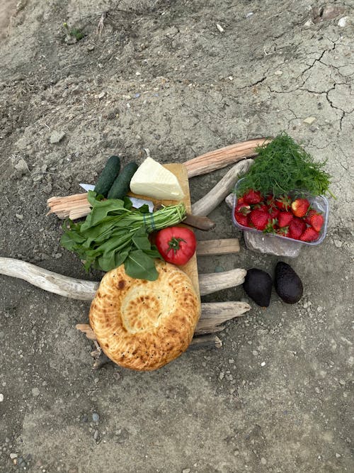 Free Bread and Assorted Vegetables on the Ground Stock Photo