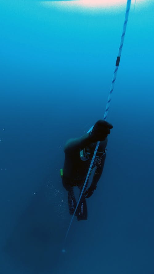 Person Diving Underwater