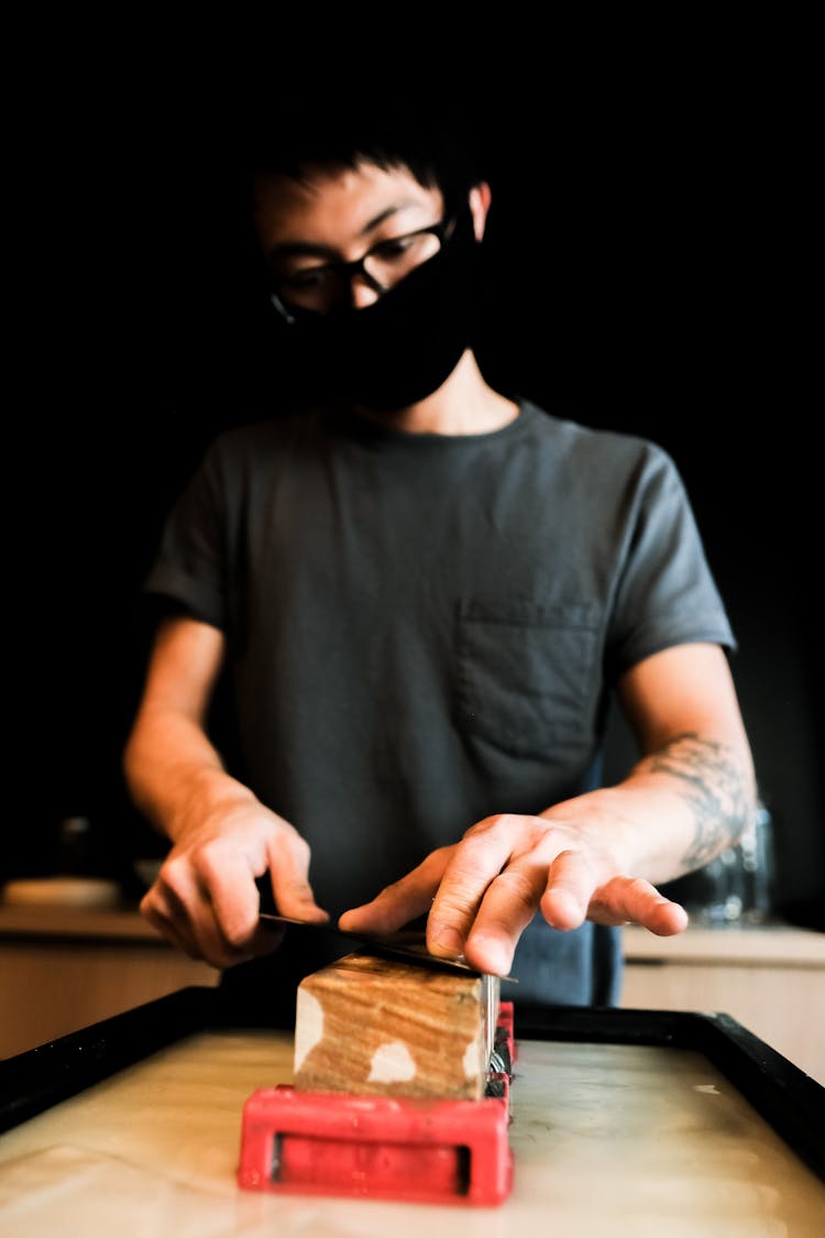 Person Sharpening A Knife