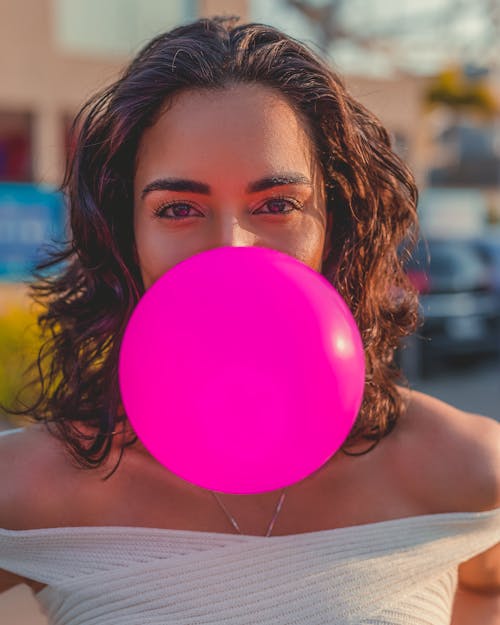 Pink Balloon in Front of a Woman