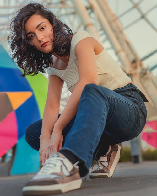 Woman Sitting on One Leg