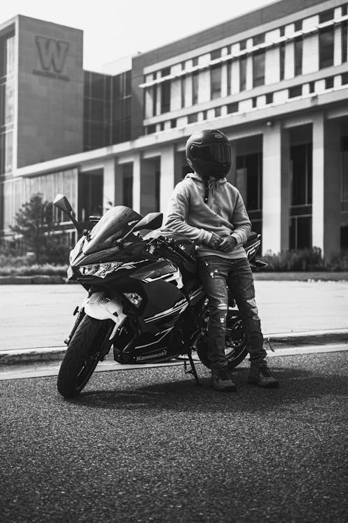 Free Monochrome Photo of Person Leaning on Motorbike Stock Photo