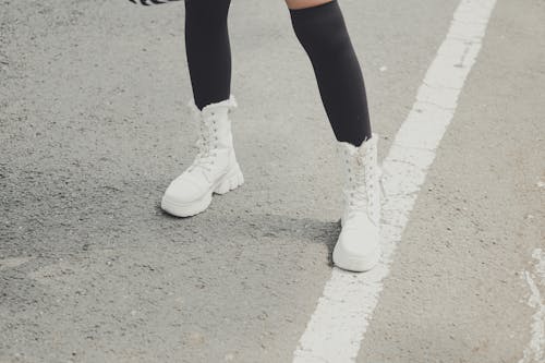 Free Legs with Black Socks and White Boots Stock Photo