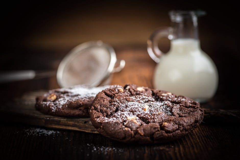 Brown Cookie Chips Near Clear Glass Jar With White Liquid