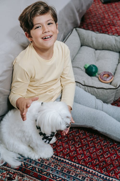 Free A Cheerful Kid with His Dog Stock Photo