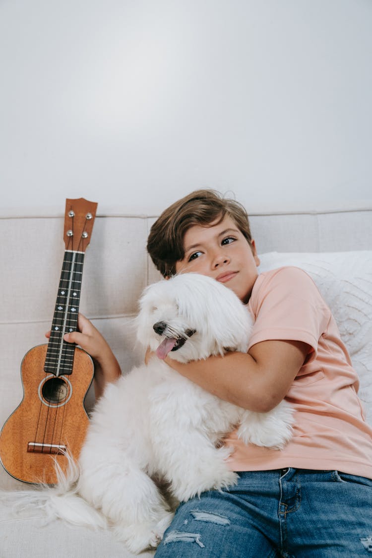 A Boy Hugging His Pet Dog