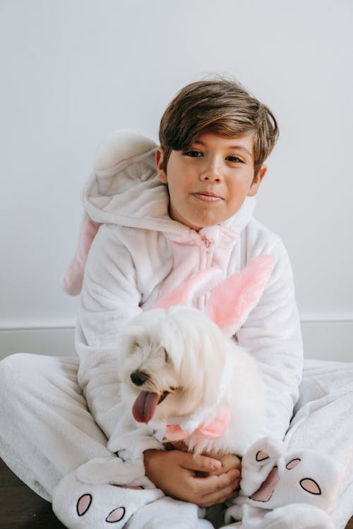 A Boy and a Dog in a Bunny Costume