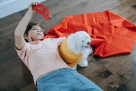 A Dog and a Boy Wearing Capes