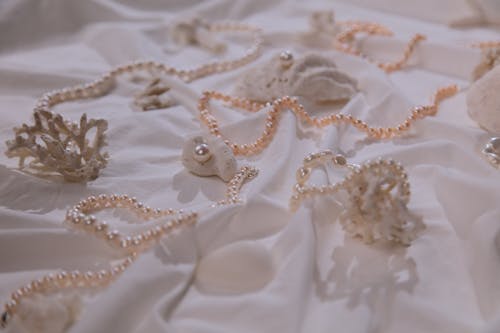 Photograph of Pearl Necklaces on a White Cloth