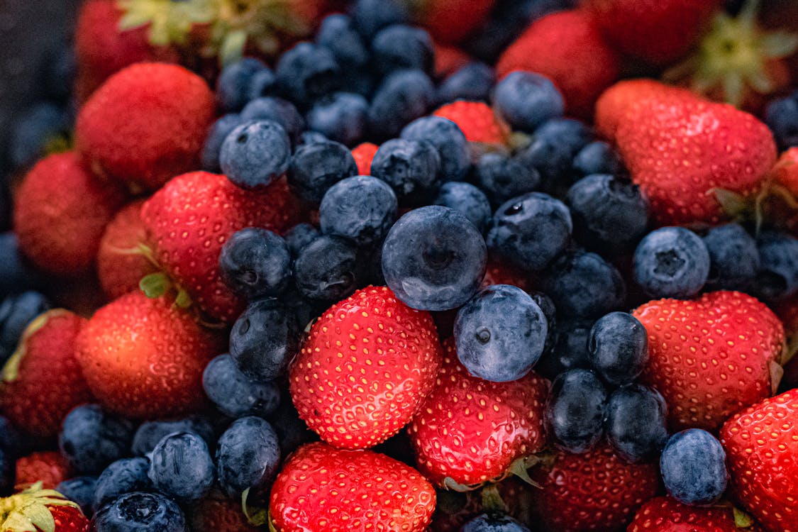 Close Up Shot of Strawberries and Blueberries