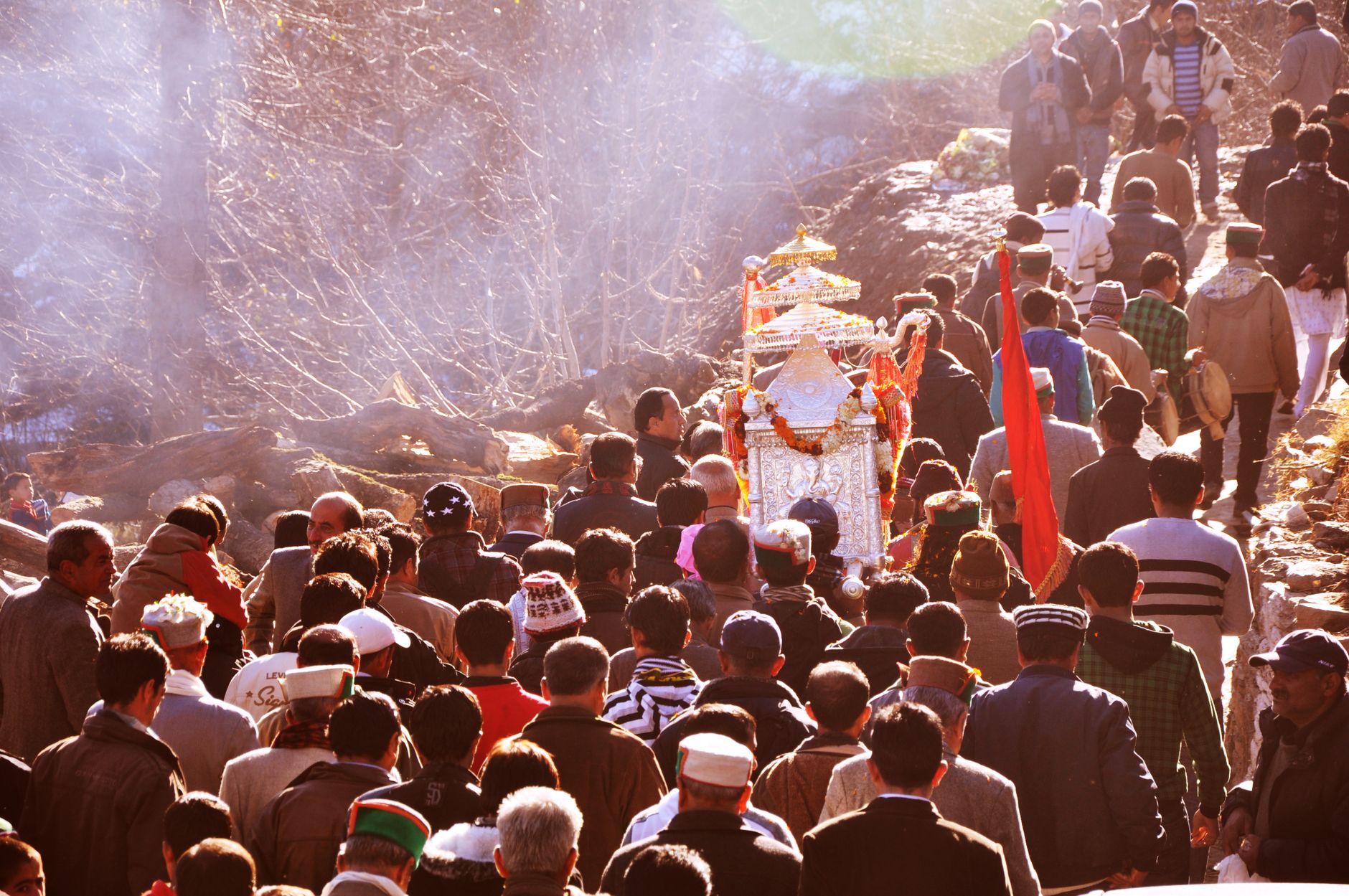 Crowded religious procession during a vibrant festival in Shimla, India, showcasing local traditions.