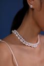 Woman Wearing White Pearl Necklace